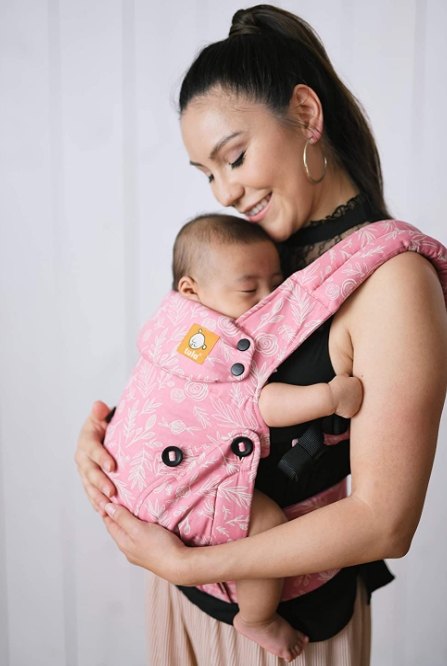 Carrying a baby can help promote a baby's speech and physical development